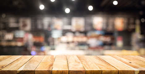 Wood texture table top (counter bar) with blur  cafe,restaurant background