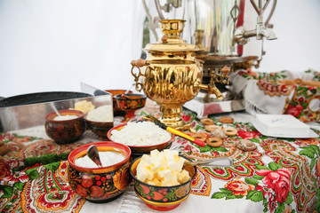 catering at a top event, glasses and flowers on the table, preparation for a significant event, beautiful dishes and glasses on the table, New Year's holiday table