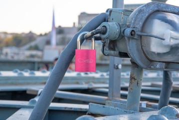 Love padlock on metal construction on brige