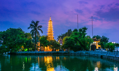 Tran Quoc Pagoda in Hanoi, Vietnam after sunset - obrazy, fototapety, plakaty