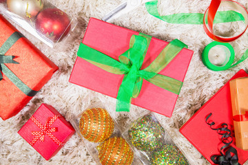Christmas gifts and ornaments on the carpet