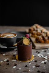 Chocolate brownie dessert on a table with cups of coffee