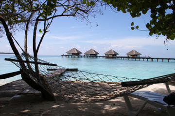 Travel, vacations and luxury concept. Hammock in luxury resort