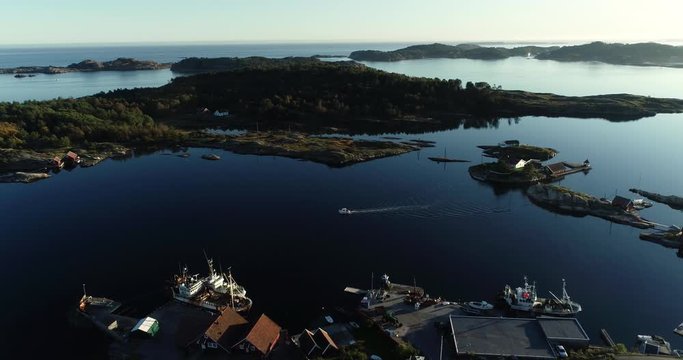 Aerial view of the boat is sailing through the isthmus in Langenes south Norway.