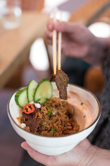 Bowl of Black Bean Beef Fried Rice, Singapore Style Dish.