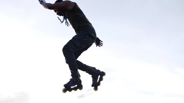 Young man extreme slow motion  jumping on the ramp 