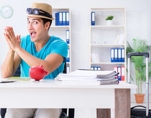 Businessman preparing for vacation in the office