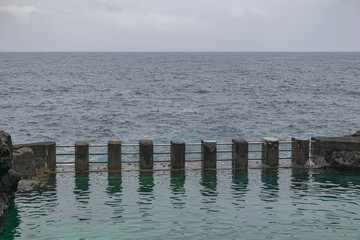 ocean water natural pool, with Atlantic Ocean and clouds background, Charco Azul, La Palma island, Canary islands, Spain