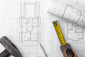 House construction plan. Hammer and measuring cup. copy space