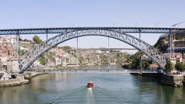 flying with drone in Porto above Dom Luis Bridge over the Douro river in Porto
