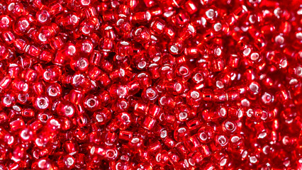 Close up Colorful red glass beads. beaded necklace or a string of beads for women