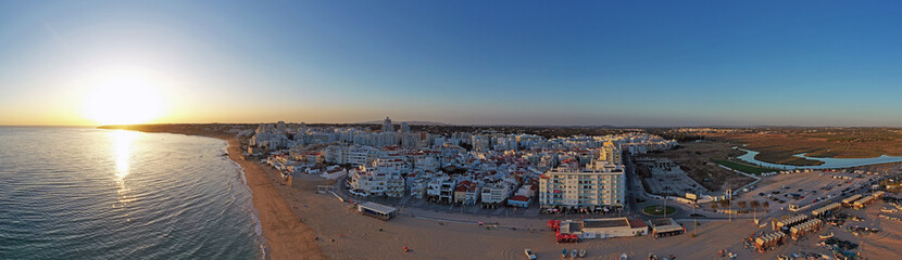 Aerial panorama from Armacao de Pera in the Algarve Portugal at sunset