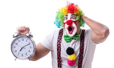 Funny clown with an alarm clock isolated on white background