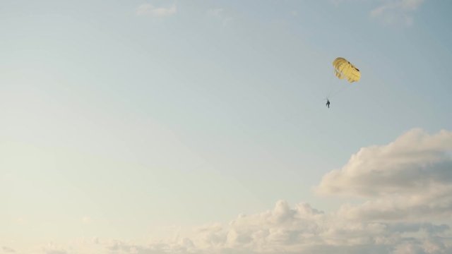 Parashute flying under the sea - Clouds and blue sky