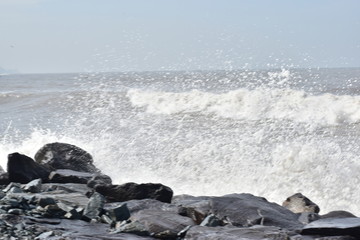 waves crashing on rocks