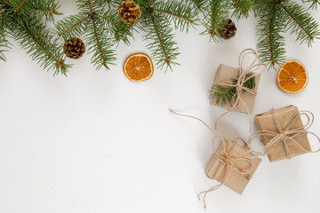 Christmas flat lay gifts in boxes in eco friendly packaging on a white background, Christmas zero waste, ecology