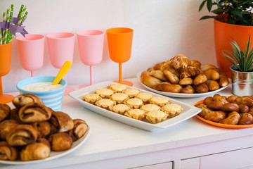 buffet for celebration birthday food on plates, home made sandwiches and decorations