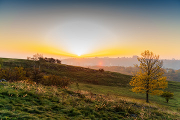 autumn landscape with mountains at sunrise