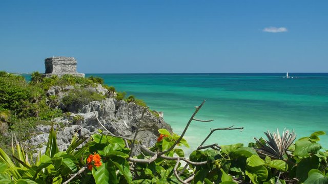 Maya ruins next to the turquoise caribbean sea, Tulum, Quintana Roo, Mexico. Slowmotion