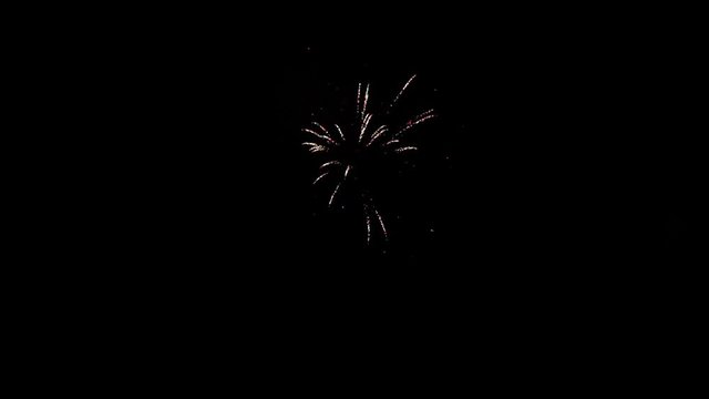 Part of the fireworks bursting on black background on celebration.