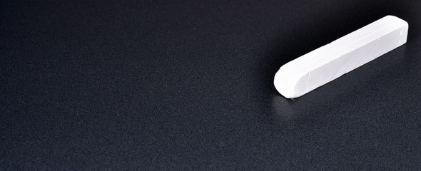 Blackboard and a piece of chalk