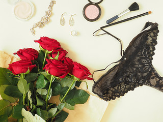 Women's panties, cosmetics, a bouquet of flowers. The concept of female beauty, female happiness.