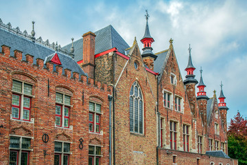 Fototapeta premium Architectural facade detail at old buildingas in Bruges, Belgium