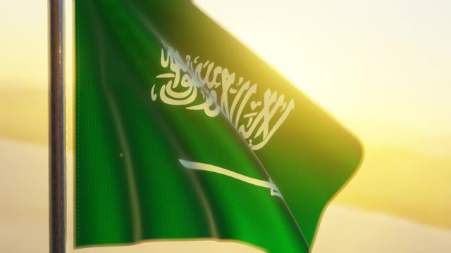 Saudi Arabia flag waving in the wind at sunset
