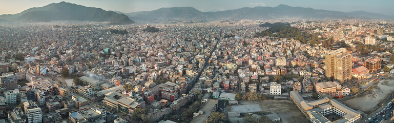 Panoramic view from the drone to the capital of Nepal, Kathmandu. Sunset cityscape in Thamel district, the main tourist and historical district of Kathmandu.