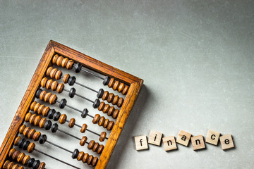 Old wooden scratched vintage decimal abacus on concrete background. Top view. Mock up. Copy space