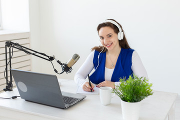 Radio host concept - Portrait of woman radio presenter with headphones