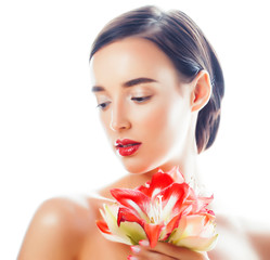 young pretty brunette real woman with red flower amaryllis closeup isolated on white background. Fancy fashion makeup, bright lipstick, creative Ombre manicured nails