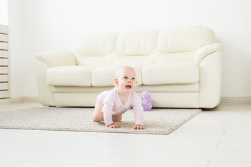 beautiful smiling baby crawling for the first time.