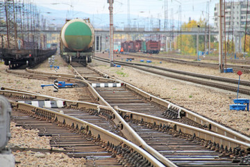 Railroad and freight cars, railroad arrow, stone embankment.