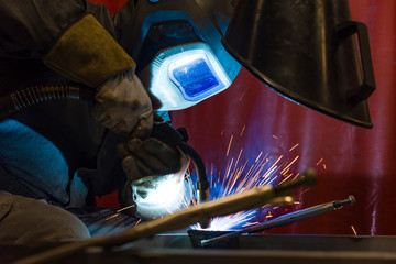 Industrial steel welder in factory welder, craftsman