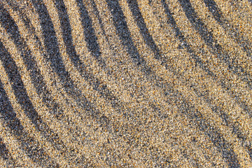 Diagonal wave line pattern. Natural sand texture.