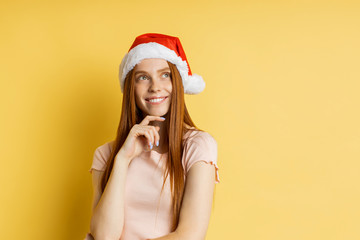 Beautiful caucasian female model wearing santa hat
