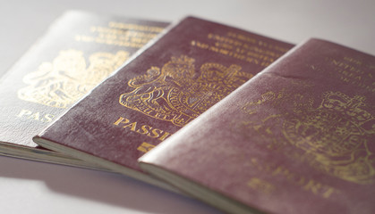 3 passports on paper surface