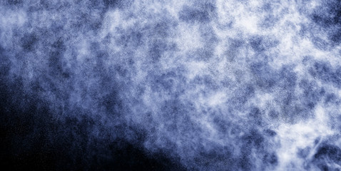 A stream of water and a cloud of drops
