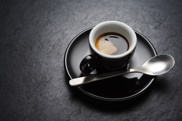 Black coffee cup on the slate background