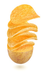 Potato chips flying out of halved potato vegetable isolated on white