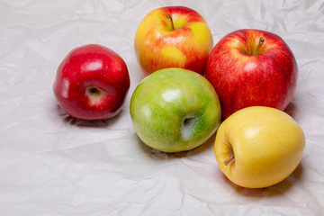 A variety of colorful and healthy yellow, green and red apples