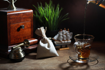 Fototapeta na wymiar Brewing tea on a wooden table