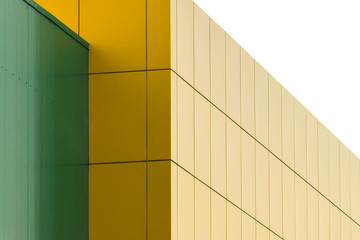 Geometric color elements of the building facade with planes, lines, corners with highlights and reflections for an abstract background and texture of green, yellow, blue, white colors. Place for text