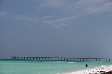 pier over emerald water of gulf of mexico at navarre florida