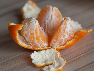 orange tangerine brushed lying on the table
