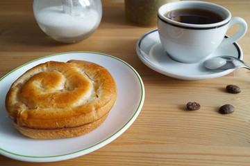 coffee still life - cinnamon roll