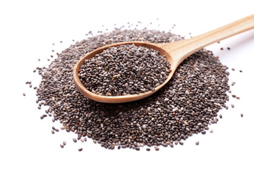 Chia seeds in wooden spoon isolated on white background. Superfood concept