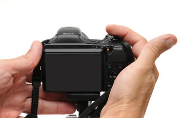 Digital photo camera on a white background