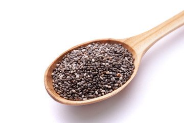 Chia seeds in wooden spoon isolated on white background. Superfood concept